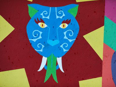 A Painting Of A Blue Cat With Yellow Eyes