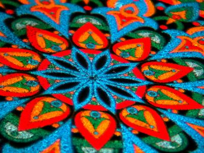 A Close Up Of A Colorful Design On A Table