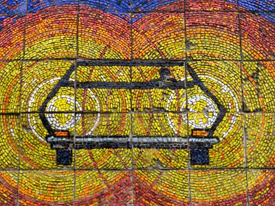 A Mosaic Wall With A Bike On It