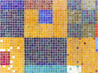 A Multicolored Tiled Wall With A Blue Square In The Middle