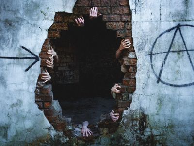 A Person Standing In A Doorway