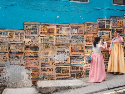 Two Women In Traditional Korean Hanbok Posing By Colorful