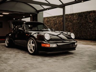 Black Porsche 911 Parked In Garage