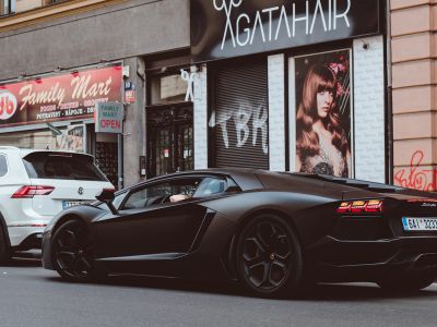 Black Sports Car On Asphalt Road