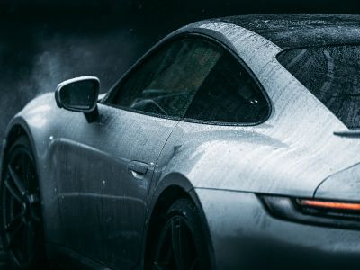 Grayscale Photo Of Car On Road