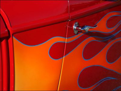 Red Car Door With Orange And Yellow Flame Graphics