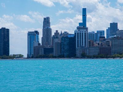 A Large Body Of Water With A City In The Background