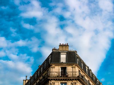 A Tall Building With A Sky Background