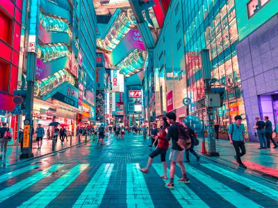 People Walking On Road Near Well Lit Buildings