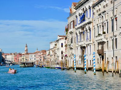 Person Riding Boat On Body Of Water