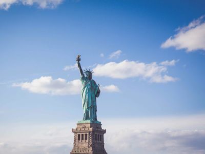 Statue Of Liberty New York Under White And Blue Cloudy Skies