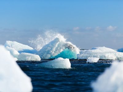 Icebergs Floating On Body Of Water During Daytime