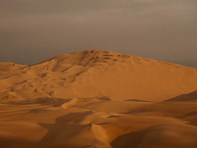 Snow Covered Mountain Under Gray Sky