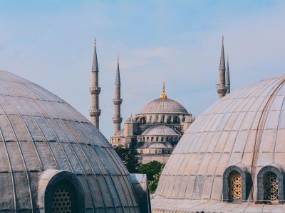 A Group Of Domes With A Sky Background