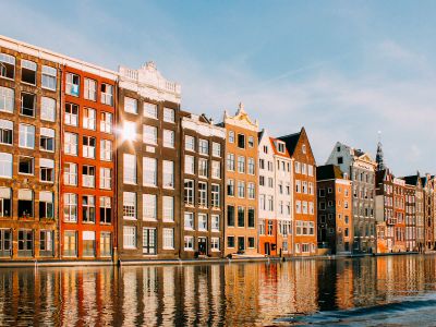 Assorted Color Buildings Beside Body Of Water