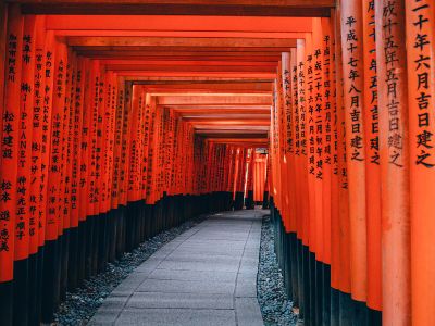 Gray Pathway Between Red And Black Wooden Pillar