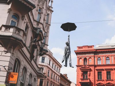 Man In Suit Holding Umbrella Statue