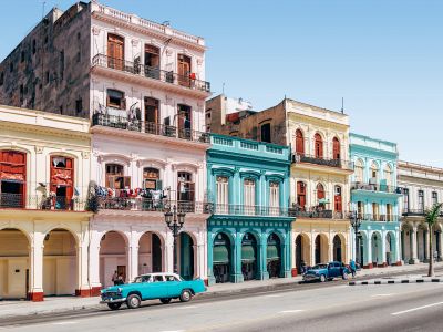 Two Cars Parked Outside Building